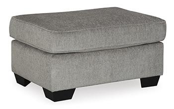 Ashley Furniture Altari Ottoman in neutral fabric with tufted top and wooden block legs, ideal as a versatile living room accent piece.