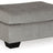 Ashley Furniture Altari Ottoman featuring a plush fabric top and wooden legs, designed for versatile living room seating.