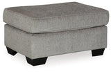 Ashley Furniture Altari Ottoman featuring a plush fabric top and wooden legs, designed for versatile living room seating.