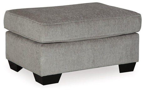Ashley Furniture Altari Ottoman featuring a plush fabric top and wooden legs, designed for versatile living room seating.