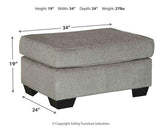 Ashley Furniture Altari Ottoman showing a beige fabric ottoman with a cushioned top and wooden legs.