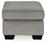 Ashley Furniture Altari Ottoman, plush fabric with tufted design, rectangular shape, used as a versatile living room accent piece.