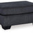 Ashley Furniture Altari Ottoman showing a stylish fabric-covered ottoman with wooden legs, ideal for living room decor.