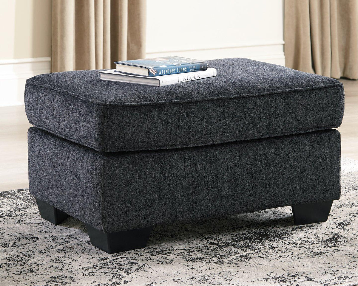 Ashley Furniture Altari Ottoman with fabric upholstery and wooden legs, showcasing a stylish and versatile living room accent piece.