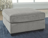 Ashley Furniture Altari oversized accent ottoman with plush fabric and modern design, perfect as a stylish footrest or accent piece.
