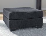 Oversized Ashley Furniture Altari accent ottoman with plush fabric and tufted top, perfect for living room decor.