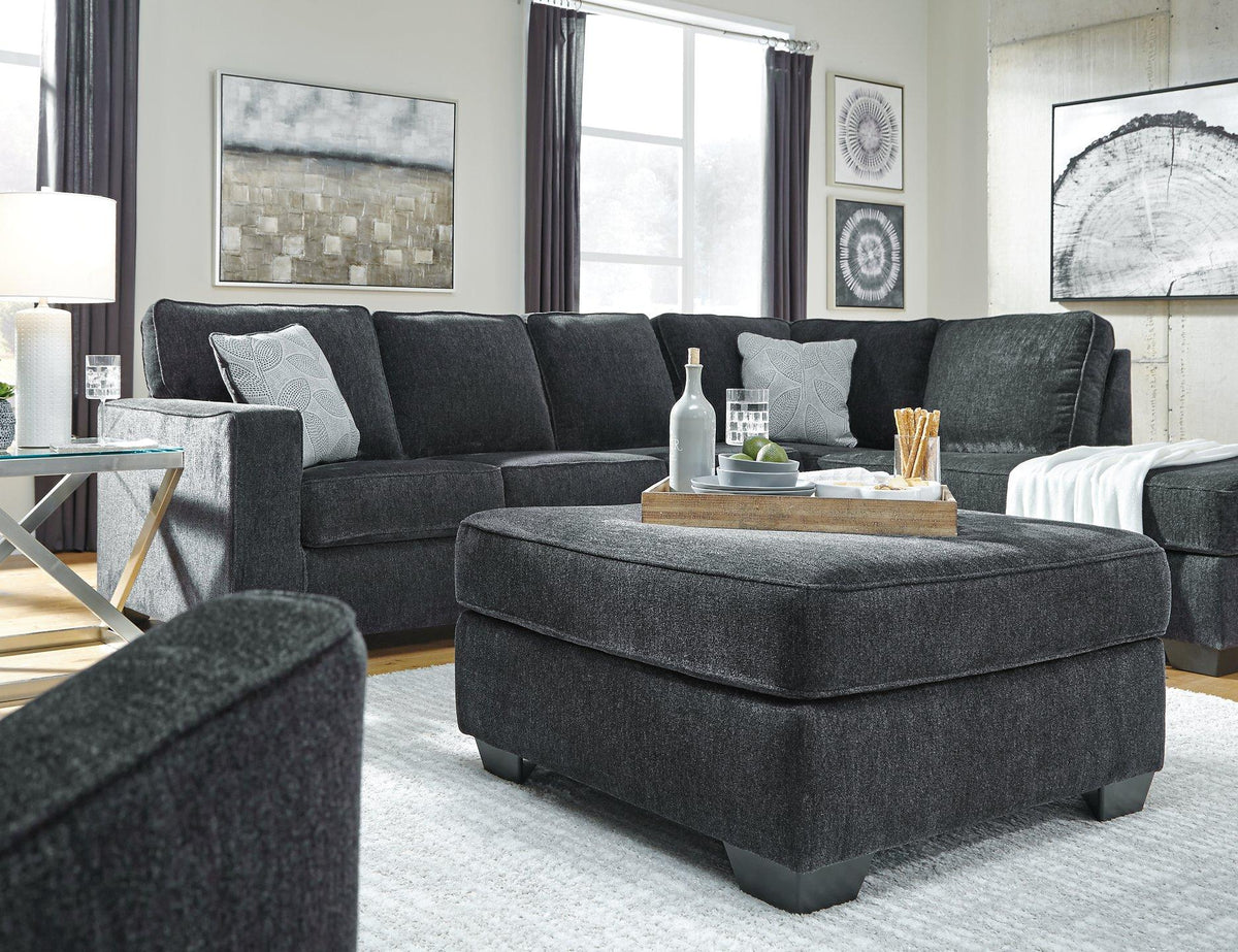Ashley Furniture Altari oversized accent ottoman with plush fabric and sturdy wooden legs, perfect for living room decor.