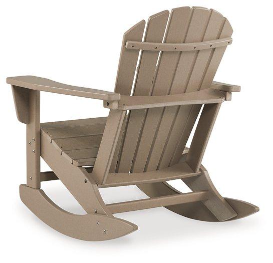 Ashley Furniture Sundown Treasure outdoor rocking chair with wood armrests and cushioned seat, ideal for relaxing outdoor spaces.