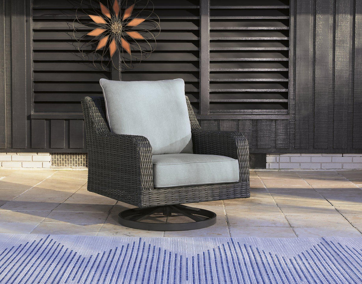 Outdoor swivel lounge chair with cushion from Ashley Furniture, perfect for comfortable outdoor relaxation.