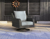 Outdoor swivel lounge chair with cushion from Ashley Furniture, perfect for comfortable outdoor relaxation.