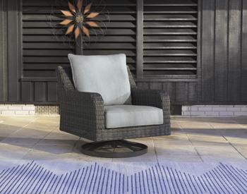 Outdoor swivel lounge chair with cushion by Ashley Furniture, featuring a stylish design ideal for outdoor relaxation.