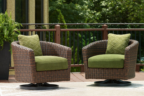 Outdoor swivel lounge chair by Ashley Furniture with a cushion, designed for patio or garden relaxation.