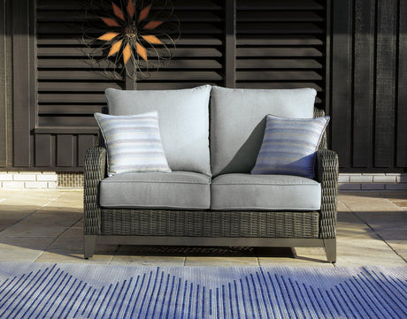 Ashley Furniture Elite Park outdoor loveseat with cushion, featuring woven design and comfortable seating for outdoor relaxation.