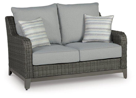 Outdoor loveseat with cushion from Ashley Furniture featuring a stylish, comfortable seating arrangement suitable for outdoor use.