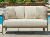 Outdoor loveseat with cushions by Ashley Furniture, featuring a sturdy frame and comfortable seating for outdoor lounging.