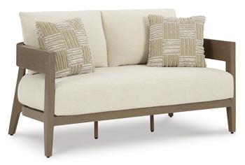 Outdoor loveseat with cushions from Ashley Furniture, featuring a serene bay design and comfortable seating for outdoor spaces.