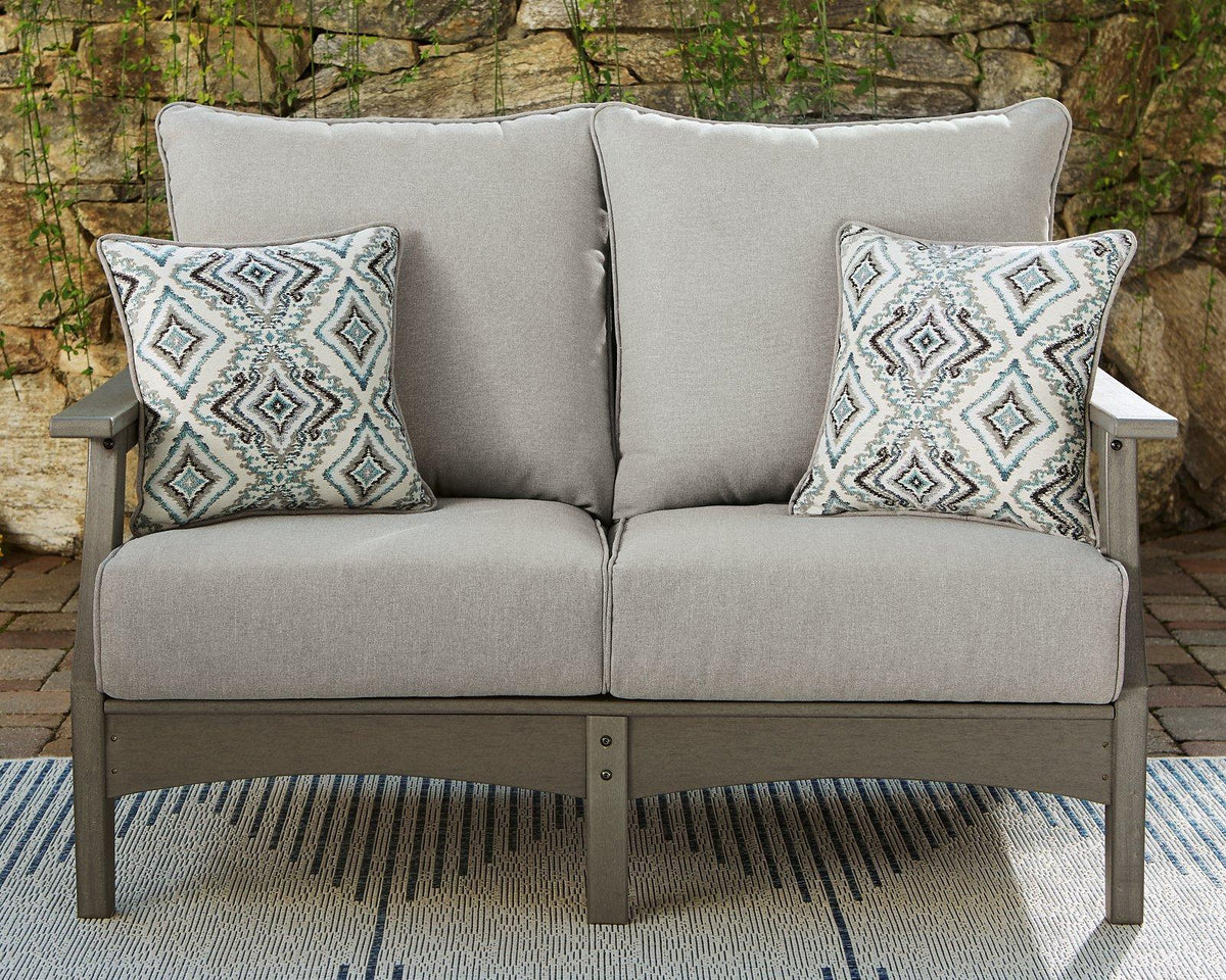 Ashley Furniture Visola outdoor loveseat with cushion, featuring a sturdy frame and comfortable seating for outdoor relaxation.