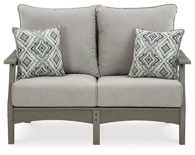Ashley Furniture Visola outdoor loveseat with cushion, featuring a cozy seating area and stylish design for outdoor relaxation.