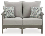 Ashley Furniture Visola outdoor loveseat with cushion, featuring a cozy seating area and stylish design for outdoor relaxation.