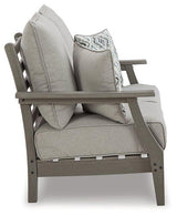 Ashley Furniture Visola outdoor loveseat with cushion, featuring weather-resistant frame and plush seating for outdoor relaxation.