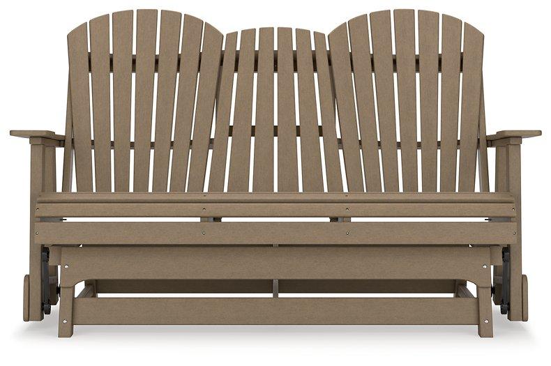 Ashley Furniture Hyland Wave outdoor glider loveseat with cushioned seating and a metal frame, perfect for patio relaxation.