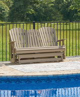 Outdoor loveseat by Ashley Furniture, Hyland wave outdoor glider loveseat with cushioned seating and wooden frame.