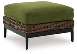 Outdoor ottoman with cushion from Ashley Furniture's Horizon Hall collection, shown from an angled side view.