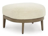 Outdoor ottoman with cushion from Ashley Furniture, featuring a woven design and sturdy frame for stylish outdoor seating.