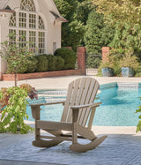 Outdoor seating set by Ashley Furniture featuring cushioned chairs and a table, perfect for outdoor relaxation.