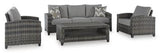 Outdoor seating set by Ashley Furniture with a sofa, chairs, and table, perfect for patio outdoor relaxation.