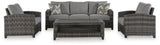 Outdoor patio set with sofa, chairs, and table from Ashley Furniture's Oasis Court outdoor seating collection.
