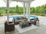 Outdoor patio furniture set by Ashley Furniture, includes sofa, chairs, and table for stylish outdoor seating.
