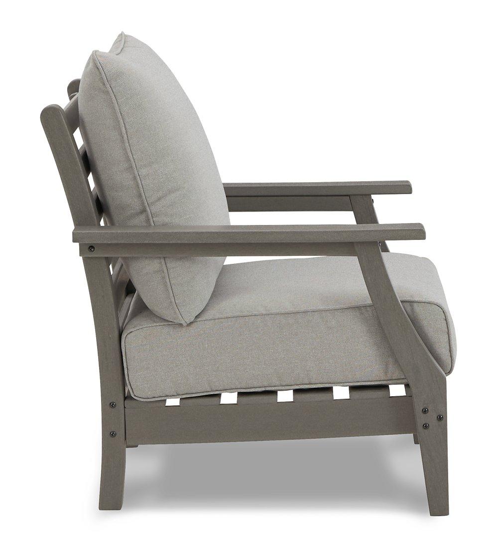 Ashley Furniture Visola outdoor loveseat conversation set with cushioned seats and weather-resistant wicker for patio relaxation.