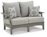 Outdoor loveseat and chair set from Ashley Furniture's Visola outdoor seating collection, with cushions and weather-resistant design.