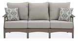 Outdoor Ashley Furniture Visola sofa and loveseat with coffee table in a cozy patio setting, featuring comfortable cushions and stylish design.