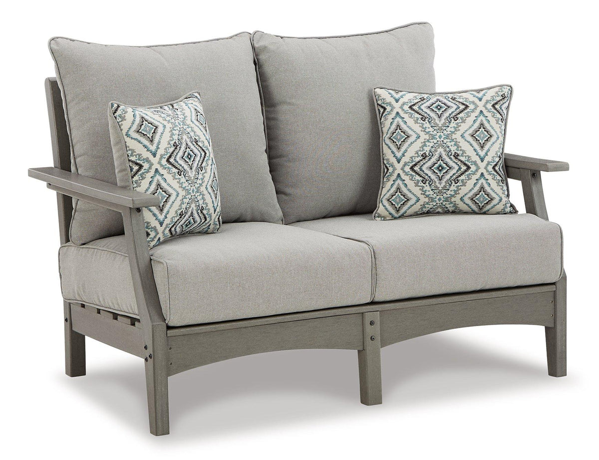 Ashley Furniture outdoor sofa and loveseat with coffee table, stylish outdoor seating set with cushions and modern design.