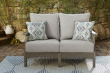 Ashley Furniture Visola outdoor sofa and loveseat with matching coffee table, stylish outdoor seating set with cushions and glass top.