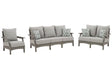 Outdoor Ashley Furniture Visola outdoor seating set with cushioned chairs and table, ideal for patio relaxation and outdoor gatherings.