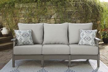 Outdoor Ashley Furniture Visola outdoor seating set with cushioned chairs and table, perfect for patio relaxation.