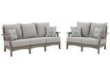 Ashley Furniture Visola outdoor seating set with cushioned chairs and table, perfect for patio or garden relaxation.