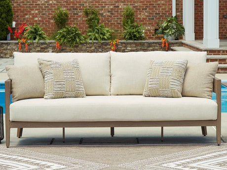 Outdoor sofa with cushions from Ashley Furniture, featuring a stylish design perfect for outdoor lounging.