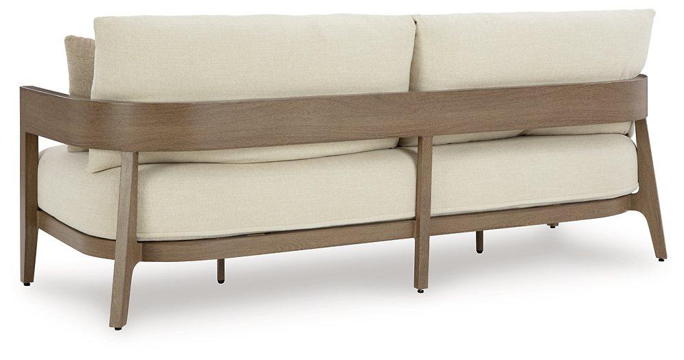 Ashley Furniture Serene Bay outdoor sofa with plush cushions, featuring a stylish design perfect for patio or garden seating.