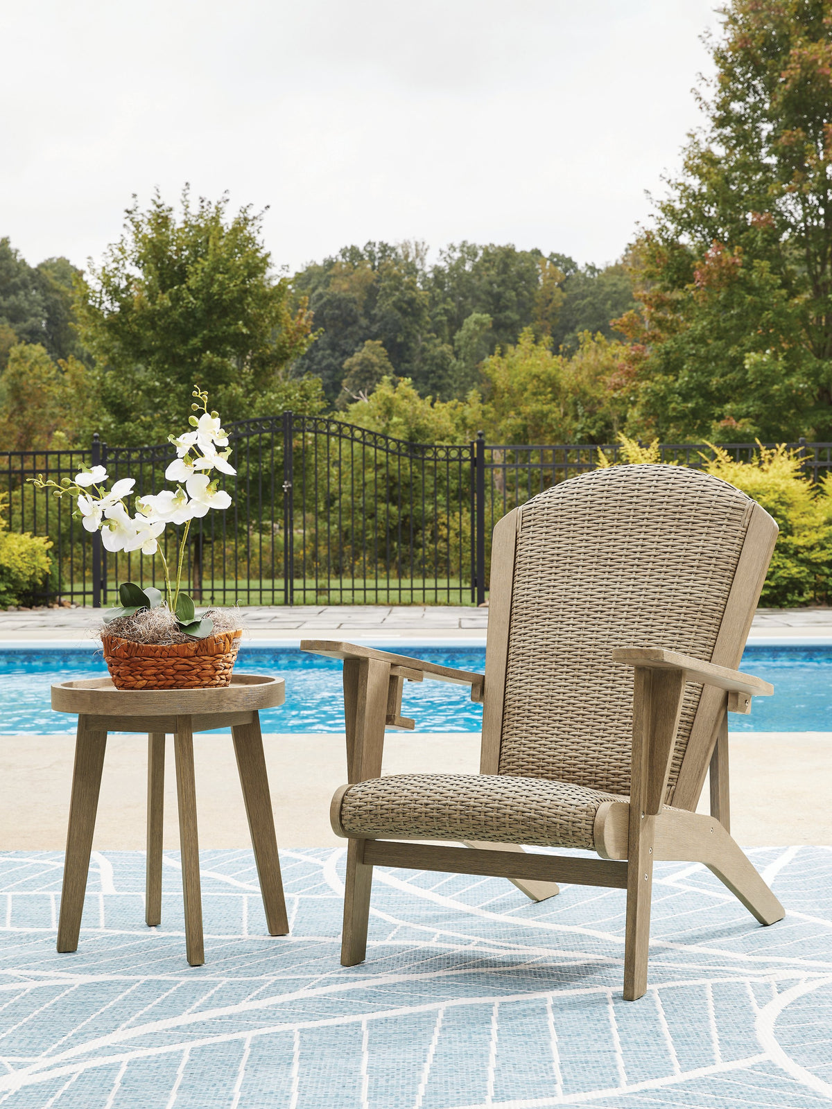 Outdoor table set from Ashley Furniture's Marina Sun collection, featuring a stylish table and matching chairs for outdoor dining.