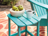 Outdoor table set from Ashley Furniture featuring a glass-top table and cushioned chairs in a stylish outdoor seating arrangement.
