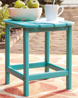 Outdoor table set from Ashley Furniture's Sundown Treasure collection with a glass-top table and matching chairs for patio seating