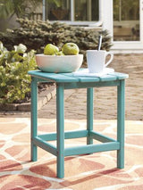 Outdoor table set by Ashley Furniture featuring a spacious table and matching chairs, perfect for outdoor dining and gatherings.
