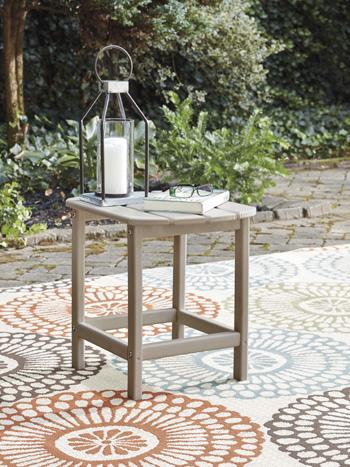 Outdoor table set from Ashley Furniture's Sundown Treasure collection, featuring a table and matching seating for outdoor relaxation.