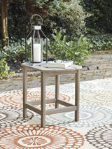 Outdoor table set from Ashley Furniture's Sundown Treasure collection, featuring a table and matching seating for outdoor relaxation.