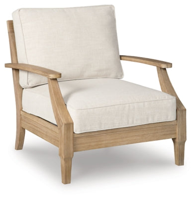 Ashley Furniture Carter Hall outdoor table set with a round table and four matching chairs in a garden setting.