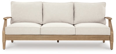 Ashley Furniture Carter Hall outdoor table set with a rectangular table and matching chairs in a modern patio design.